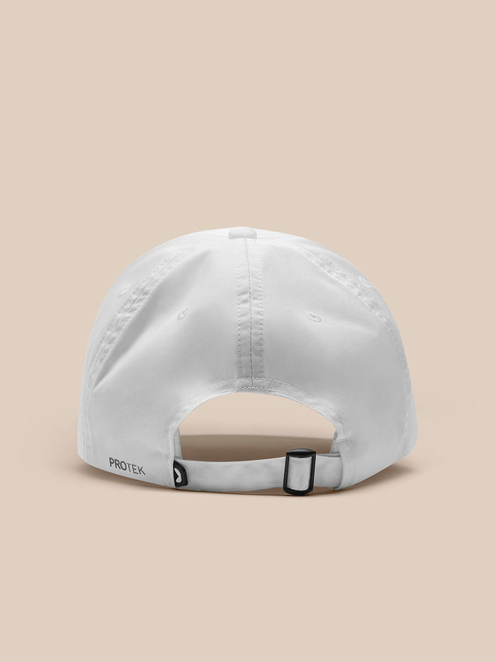 Rear view of white nylon cap with adjustable strap and black buckle; PROTEK branding visible.