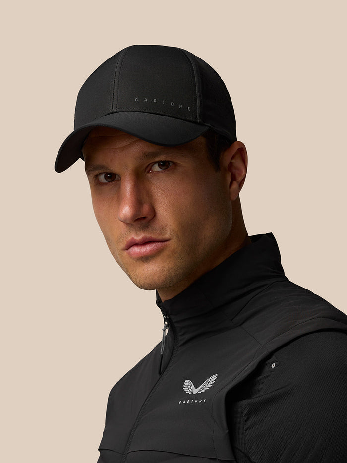 Male model wearing Active Logo Cap in black nylon with Castore branding on front.