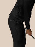 Close up of black Club Golf Trousers showing belt loops, side pocket and Castore branding on right thigh