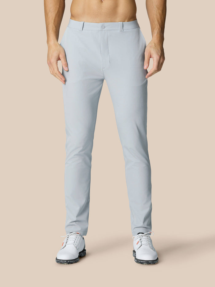 Male model in mid grey Club Golf Trousers with belt loops and side pockets.