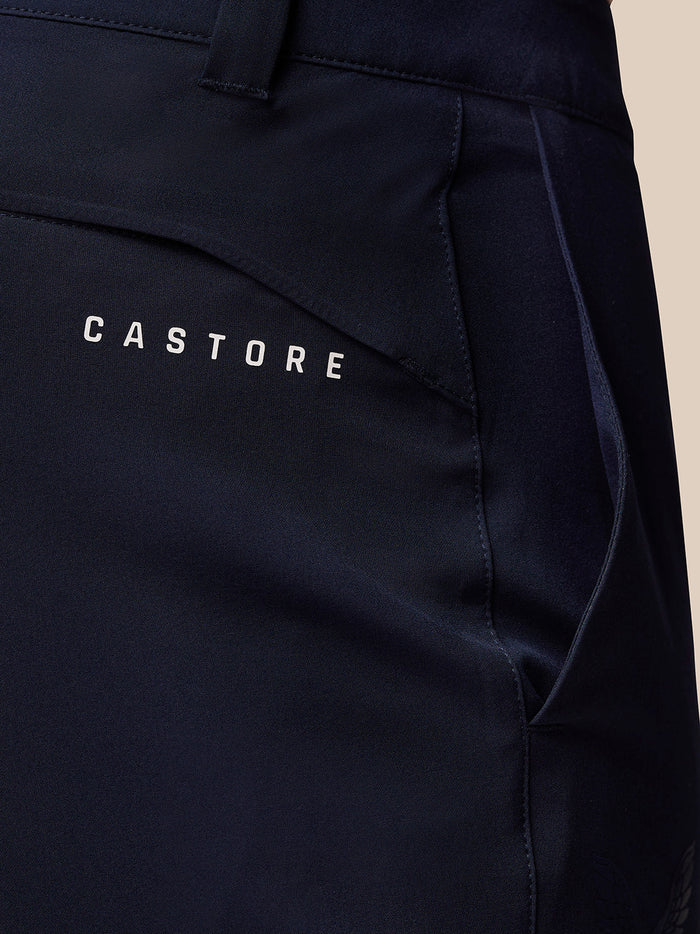 Close up of midnight navy golf trousers showing Castore branding on the right thigh.