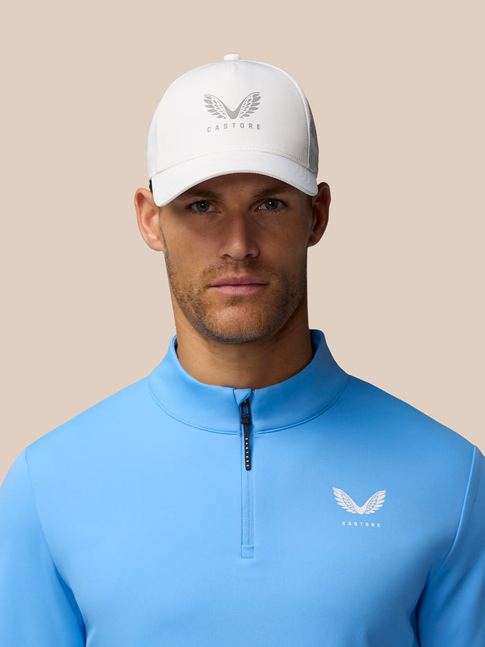 Close up of blue Golf Club Classic 1/4 Zip Top showing Castore logo on left chest.
