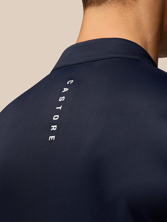 Close-up of navy Golf Club Classic 1/4 Zip Top back showing vertical Castore branding along the shoulder area
