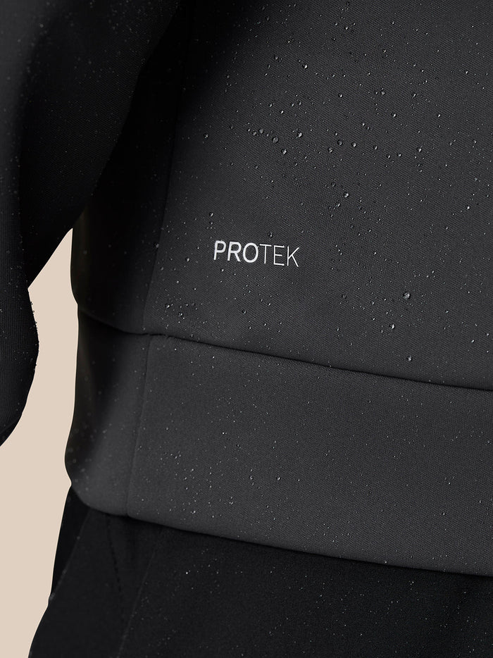 Close up of water droplets on Protek fabric of the Golf Club Classic Quarter Zip Top