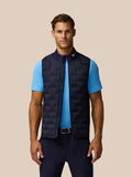 Male model wearing navy Pinnacle gilet with stand collar over a light blue polo, front view
