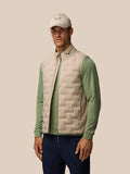 Beige Golf Pinnacle lightweight gilet with quilted front panels and funnel collar on a model.
