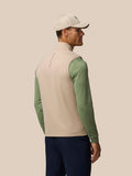 Back view of a male model wearing Mushroom Golf Pinnacle Lightweight Hybrid Gilet with logo at the collar