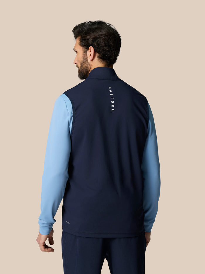 Back view of navy Pinnacle Golf Gilet showing Castore branding on the upper back