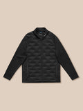 Full-body view of male model wearing black Pinnacle Golf Jacket with zip front stand collar and chest logo.