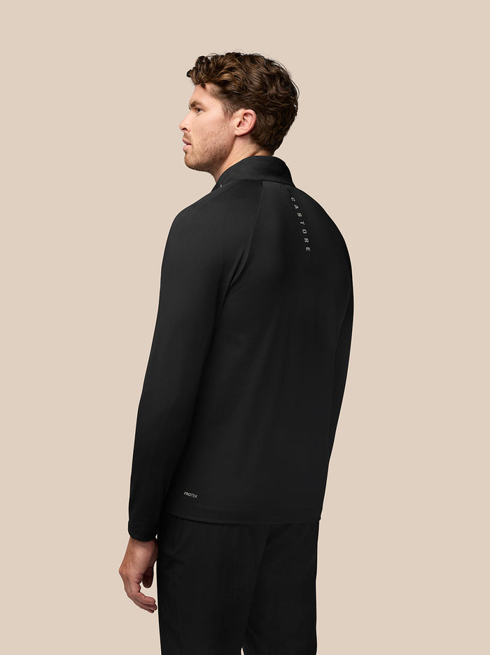 Back view of black Golf Pinnacle jacket showing stand collar and Castore branding along the upper back.