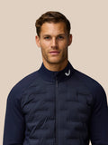 Male model wearing Golf Pinnacle Jacket in midnight navy with stand collar and full front zip