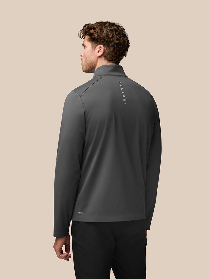 Back view of charcoal Garcia Hybrid Jacket on a model with vertical Castore branding along the spine.