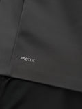 Close up of dark charcoal Protek fabric with the PROTEK branding on the jacket