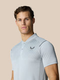 Male model wearing Pinnacle Golf LVS Polo in mid grey with diagonal chest stripes and logo.