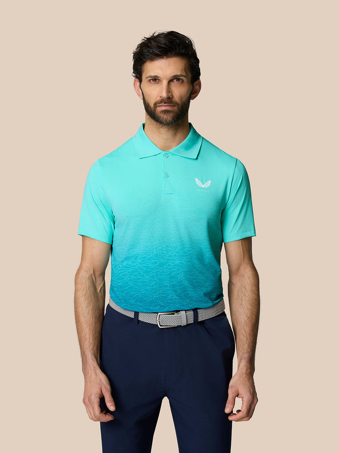 Male model wearing Club Graphic Polo in light aqua with ombre print and Castore branding on chest.