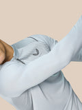 Close-up of back of Pinnacle LVS 1/4 Zip Top showing striped texture and side pocket opening