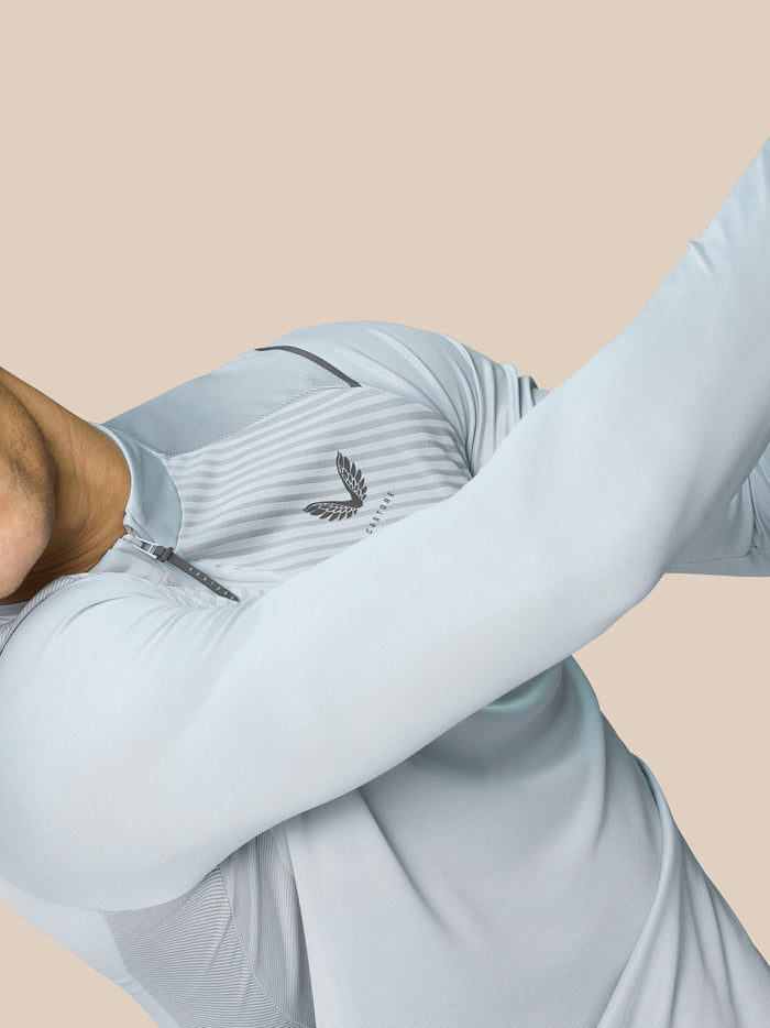 Close-up of back of Pinnacle LVS 1/4 Zip Top showing striped texture and side pocket opening