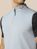 Close-up of the light grey gilet collar with half zip and Castore logo on the neck area.