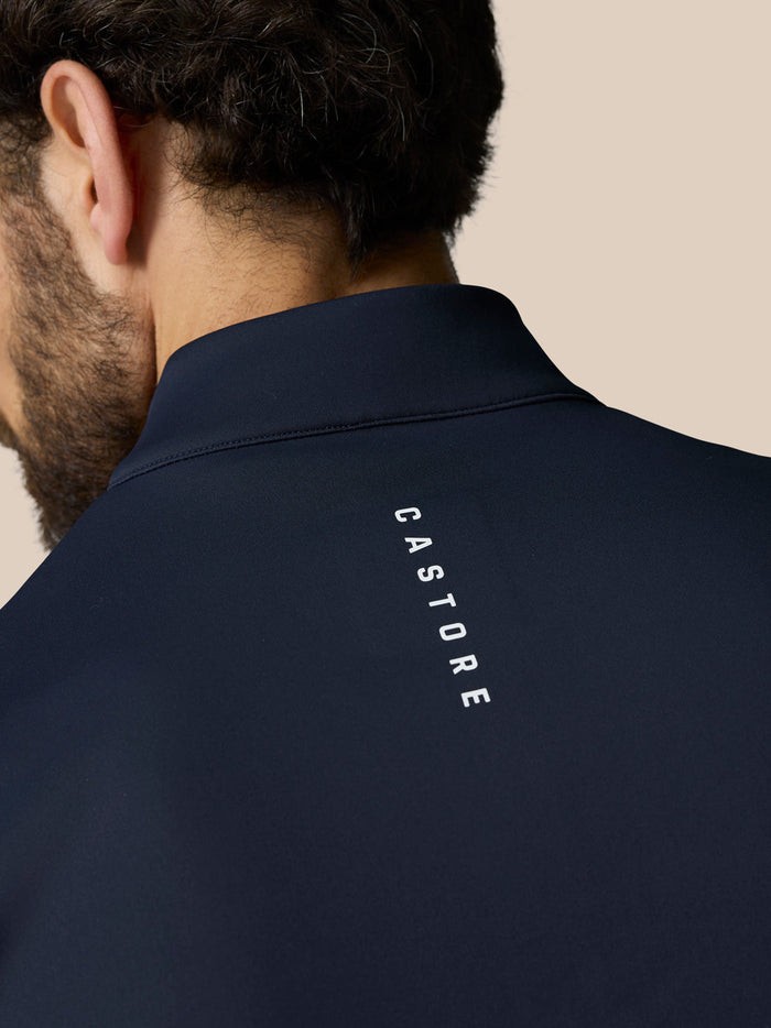Navy fabric back neck area with CASTORE branding along the upper back.