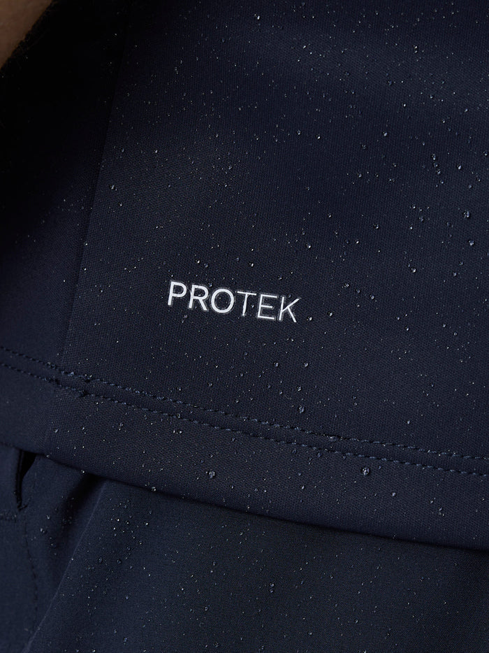 Detail of navy ProTek fabric with water droplets beading on the surface.