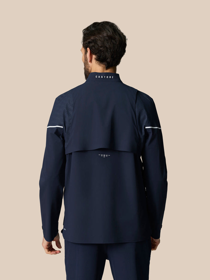 Back view of Golf Pinnacle LVS Woven Jacket in Midnight Navy showing vent panels and CASTORE logo at the neck