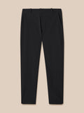 Front view of black Golf Pinnacle Winter Trousers showing waist with belt loops and button closure.