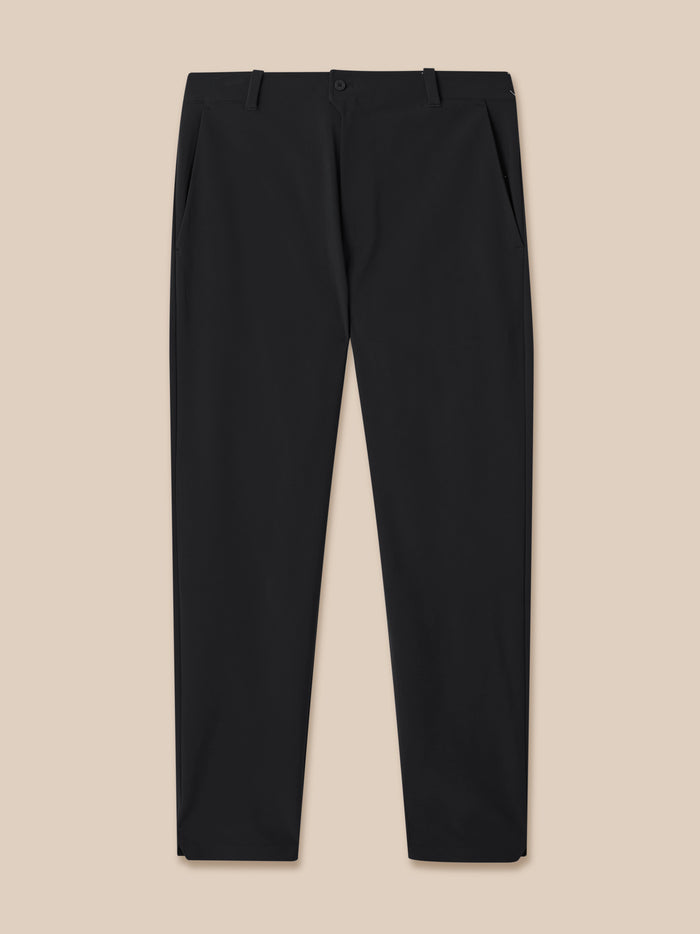 Front view of black golf trousers with belt loops and front closure Castore branding visible