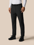 Model wearing black Pinnacle Winter Trousers with belt shown full length for winter golf