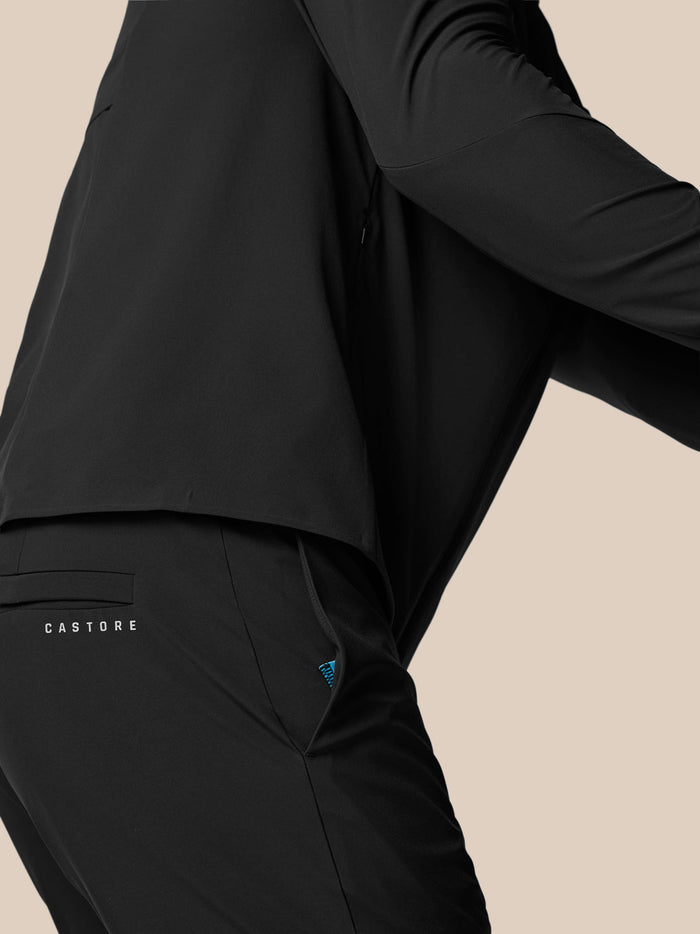 Close-up of black Golf Pinnacle Winter Trouser back pocket with Castore branding and blue zipper detail