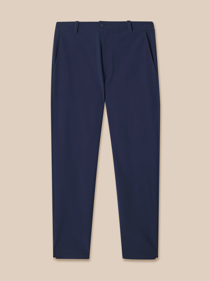 Back view of navy Castore golf winter trousers with branding on the back pocket