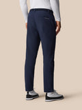 Back view of Castore Golf Pinnacle Winter Trousers in midnight navy with belt and back welt pockets.