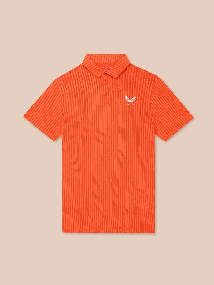 Close-up of Pinnacle Glow polo in bright orange showing striped knit, collar and Castore logo on left chest
