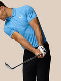 Golfer wearing a Cool Blue Glow Printed Polo during a swing, showing striped texture and Castore logo on the chest