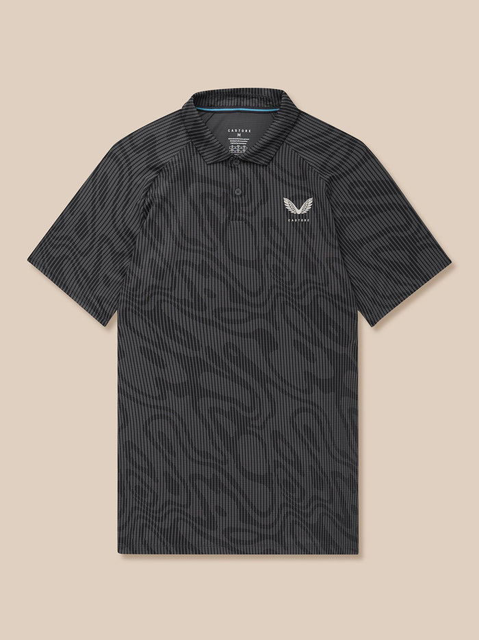 Front view of Golf Club Glow Printed Polo in gunmetal grey showing all over print and chest Castore logo