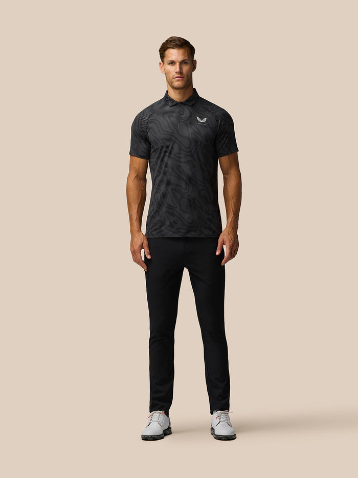 Male model wearing Golf Club Glow Printed Polo in gunmetal grey with a subtle tonal pattern.