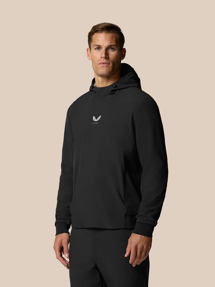 Man modeling black Golf Pinnacle Performance Hoodie with chest logo and three-panel hood