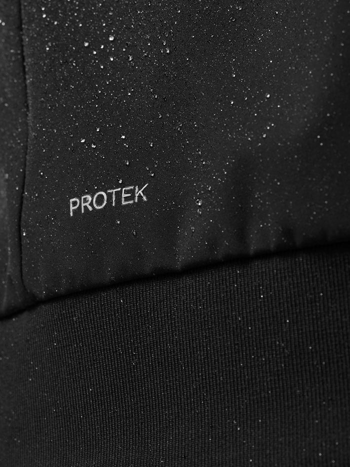 Close-up of black ProTek fabric with water droplets showing water resistance
