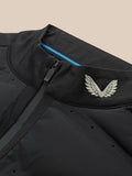 Close-up of black golf jacket collar with front zipper, white wing logo, and a blue interior stripe.