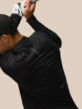 Side profile of a man wearing a black LVS golf top with neck and back branding, and a cap