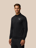 Male model in black all over print golf top with quarter zip and Castore crest on the left chest.