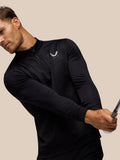 Side profile of man in black Golf Club Classic 1/4 Zip Debossed Top showing the zip detail and printed pattern