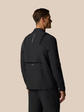 Back view of a man in black LVS Winter Jacket showing shoulder panels and vertical CASTORE branding along the back