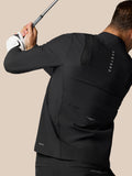 Side view of golfer wearing a black Castore Golf Pinnacle LVS jacket holding a golf club with a white glove