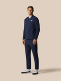 Male model wearing midnight navy Golf Pinnacle LVS Winter Jacket with front zip and left chest logo