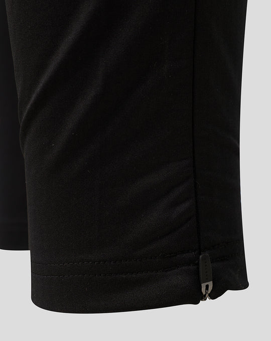Close up of the zipped lower leg on black Saracens training pants