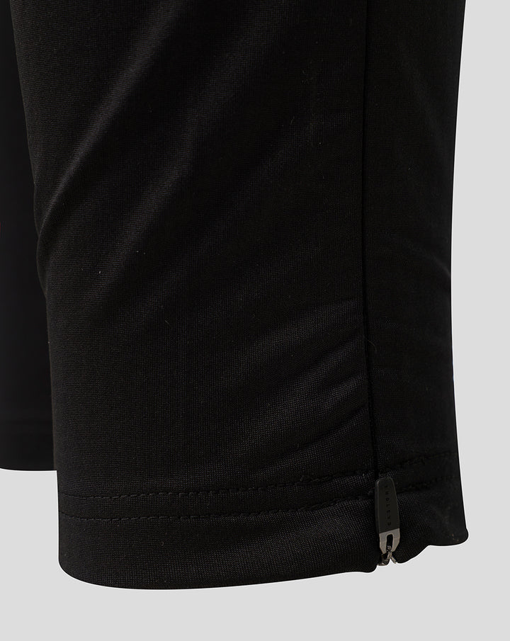 Close up of the zipped lower leg on black Saracens training pants