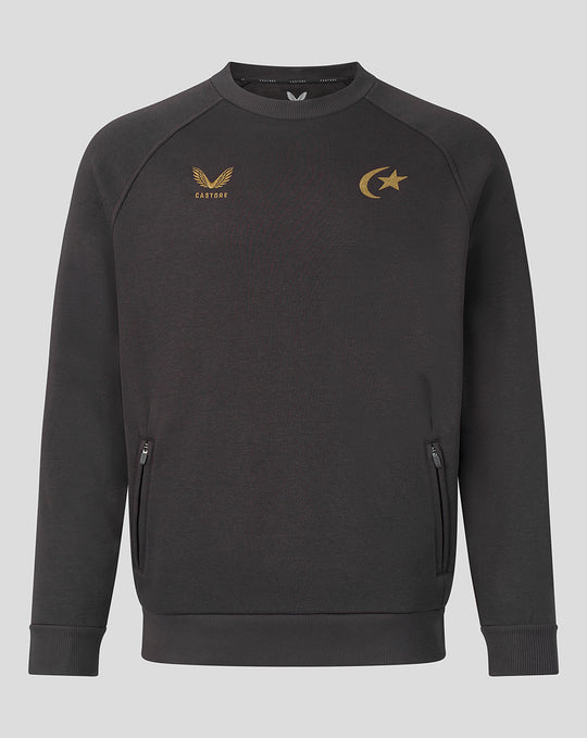 Grey travel sweatshirt with gold Castore logo and crescent star emblem on chest.