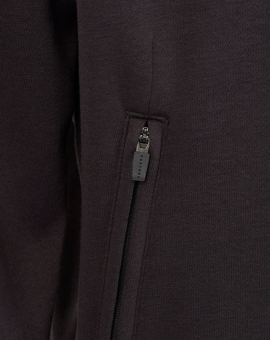 Close-up of a maroon zip pocket on a Saracens travel sweatshirt fabric with a branded zipper pull.