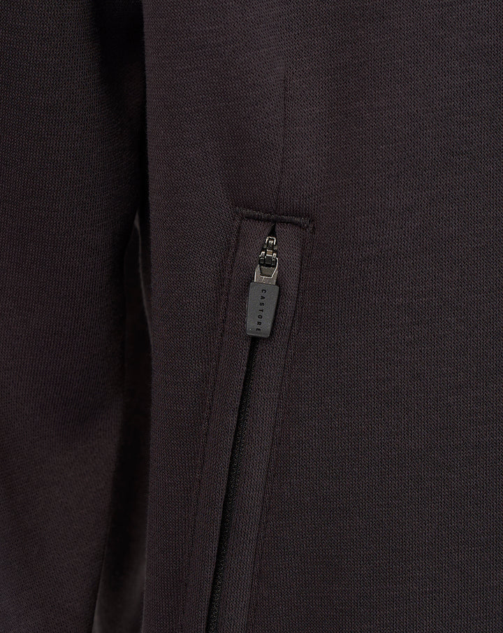 Close-up of a maroon zip pocket on a Saracens travel sweatshirt fabric with a branded zipper pull.
