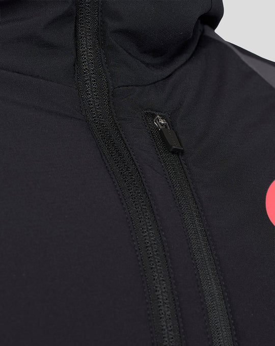 Close-up of black Saracens training jacket chest area with a vertical zipper and textured fabric